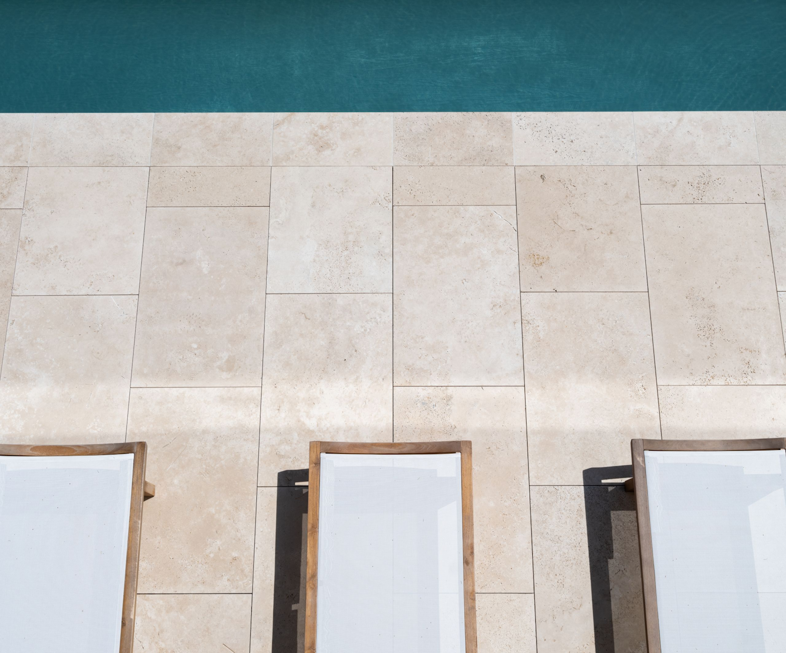 ​The whiteness of our Scala Travertine is unique to the market. It has a consistently warm light cream hue, which perfectly complements modern minimalist design.
